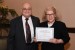 Dr. Nagib Callaos, General Chair, giving Ms. Jeanine Siebold the best paper award certificate of the session "Integrating Academic Activities & Research and Consulting (Special Session) I ." The title of the awarded paper is "2016 High School Honors Human Anatomy and Physiology Curriculum Investigation for College Board Advanced Placement Classification Validity."